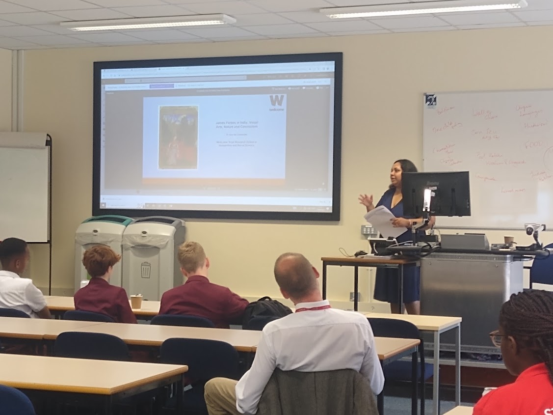 Dr Apurba Chatterjee standing in front of a screen

Description automatically generated